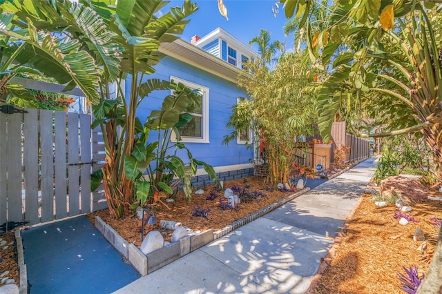 view of home's exterior featuring fence