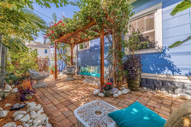 view of patio featuring an outdoor living space and a pergola