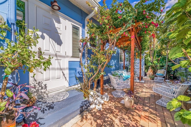 entrance to property with a patio