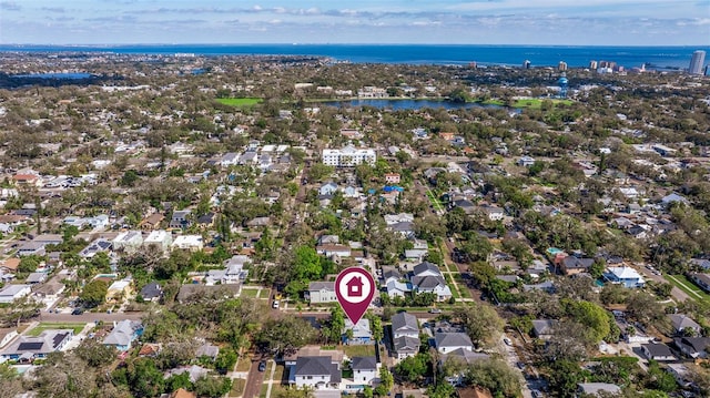 drone / aerial view with a water view and a residential view