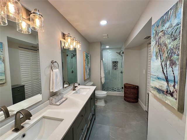 full bathroom with visible vents, a sink, a shower stall, and toilet