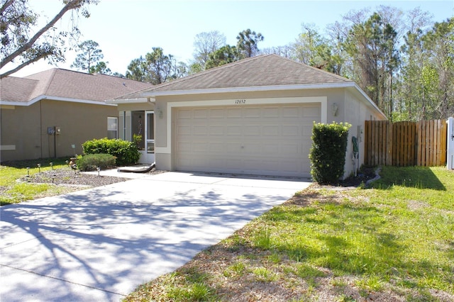 ranch-style house with stucco siding, driveway, fence, roof with shingles, and a garage