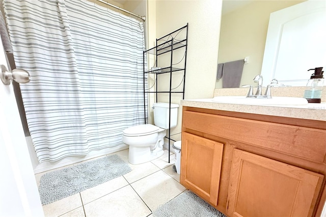 full bathroom with tile patterned flooring, curtained shower, toilet, and vanity