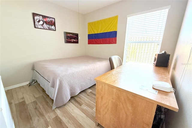 bedroom with light wood-style flooring