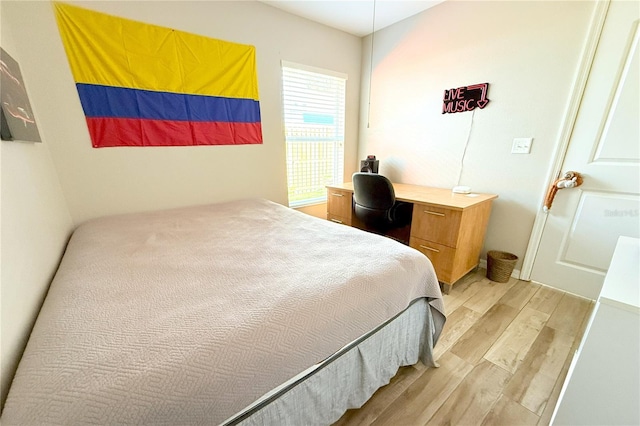 bedroom with light wood-type flooring