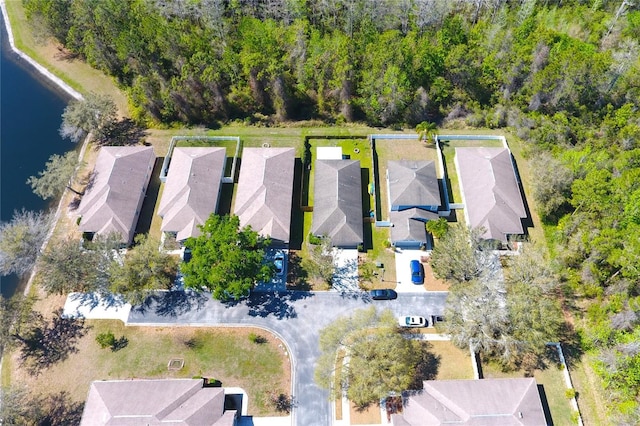 drone / aerial view featuring a residential view and a water view