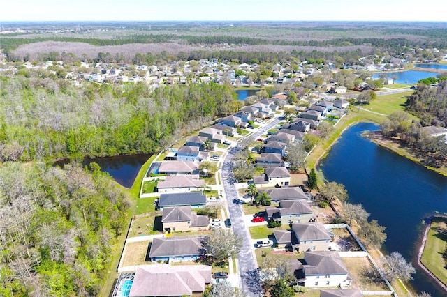 bird's eye view featuring a residential view and a water view