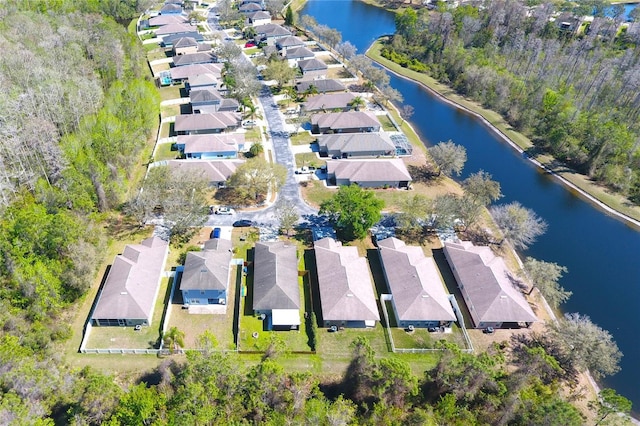 bird's eye view featuring a residential view and a water view