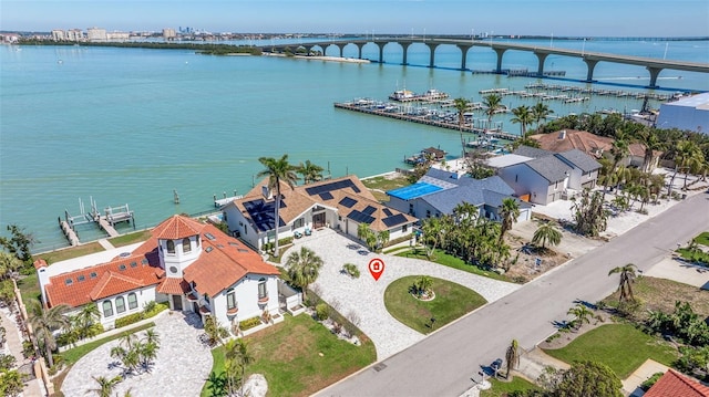 birds eye view of property with a water view