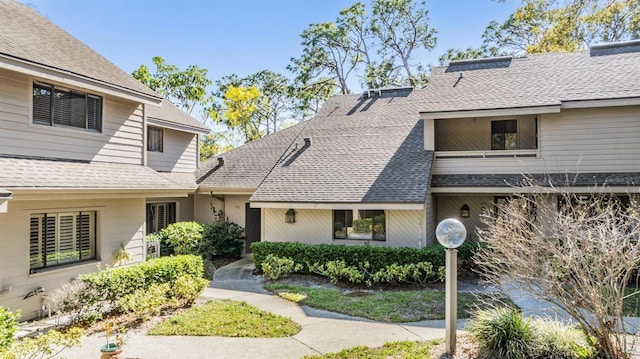 view of front of home with roof with shingles