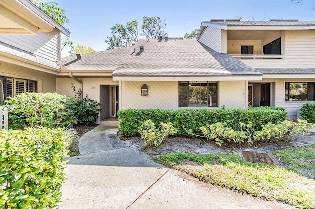 view of front of house with a shingled roof