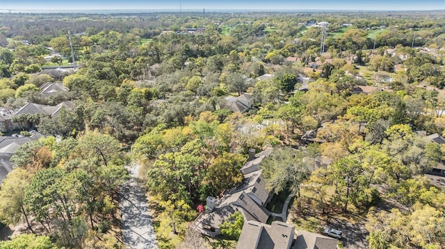 aerial view featuring a wooded view