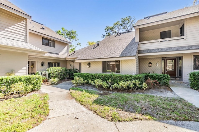 view of front of property featuring roof with shingles