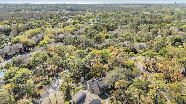 bird's eye view featuring a wooded view