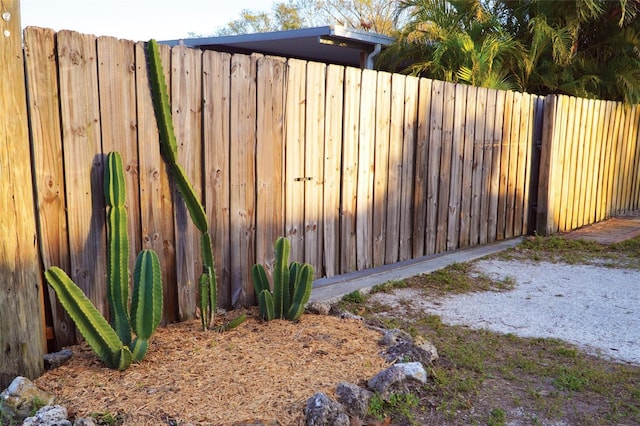 view of gate featuring fence