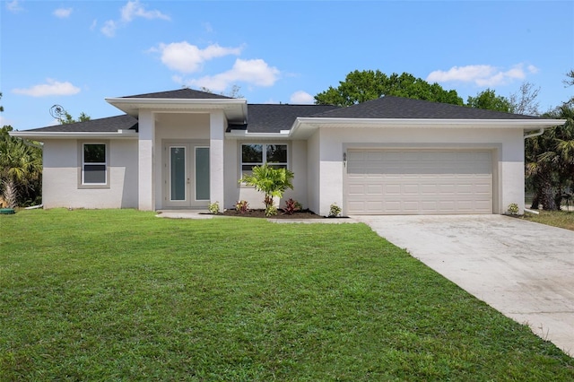 prairie-style home with a garage, driveway, french doors, stucco siding, and a front lawn