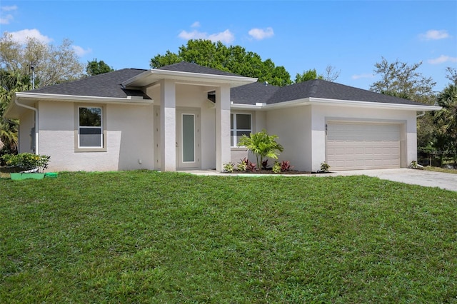 view of front of house featuring a garage, driveway, a front yard, and stucco siding