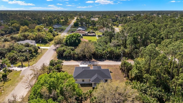 drone / aerial view with a view of trees