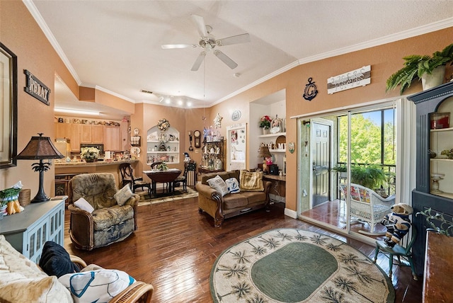 living area with lofted ceiling, hardwood / wood-style flooring, a ceiling fan, built in features, and crown molding