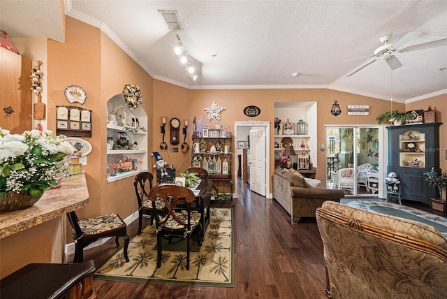 dining space featuring ceiling fan, wood finished floors, visible vents, vaulted ceiling, and crown molding