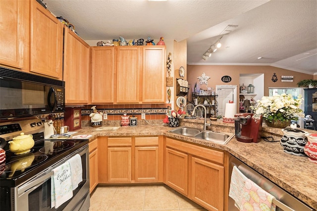 kitchen with stainless steel appliances, light countertops, a sink, and light tile patterned floors