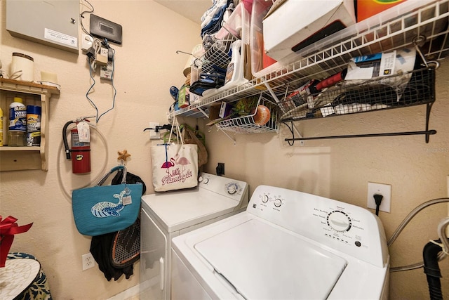 washroom featuring laundry area and separate washer and dryer