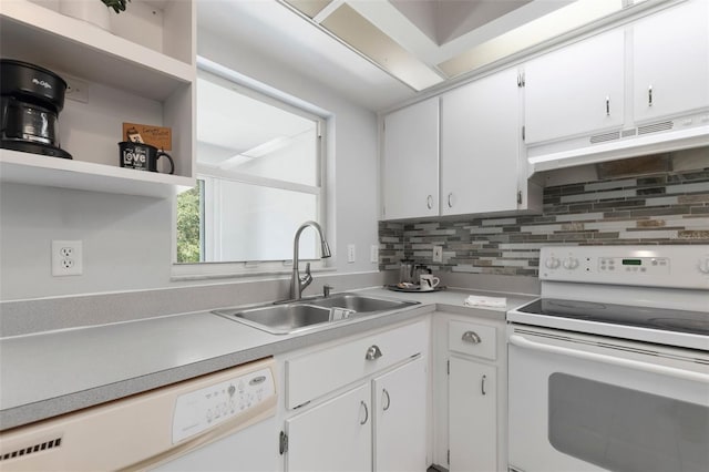 kitchen featuring white appliances, a sink, light countertops, under cabinet range hood, and tasteful backsplash