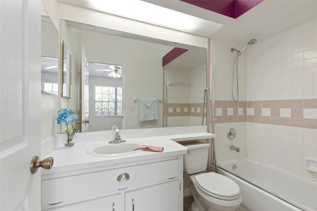 full bathroom featuring vanity, toilet, shower / bathtub combination, and ceiling fan