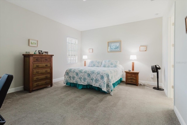 carpeted bedroom with baseboards