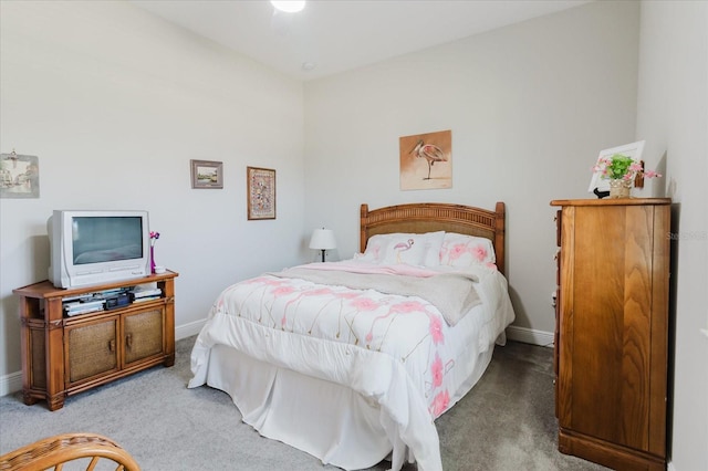 bedroom with baseboards and carpet floors