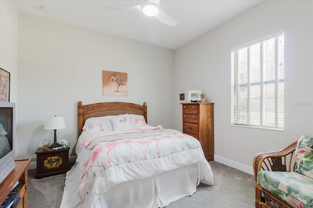 bedroom with baseboards, carpet floors, and ceiling fan