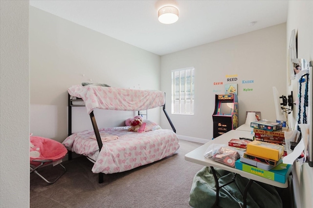 bedroom featuring baseboards and carpet floors