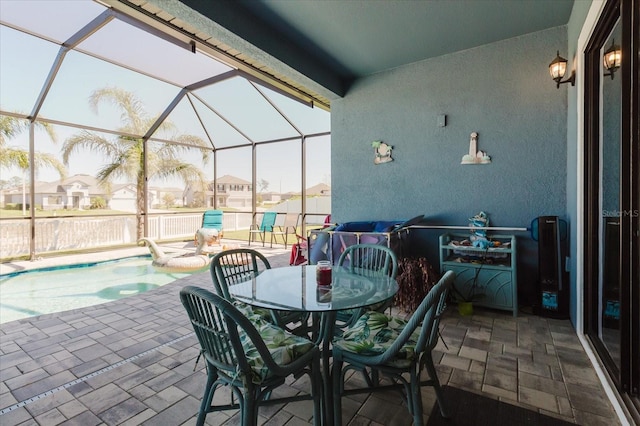 view of patio / terrace featuring a lanai and an outdoor pool