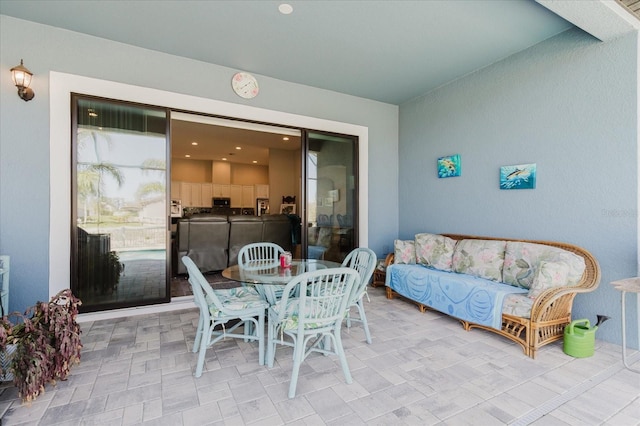 view of patio with washing machine and clothes dryer and outdoor dining space