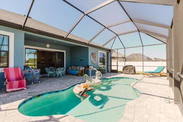 view of pool with a lanai, a fenced in pool, a patio, and fence