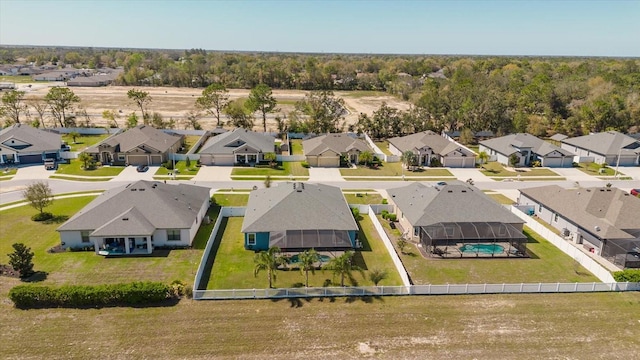 birds eye view of property with a residential view