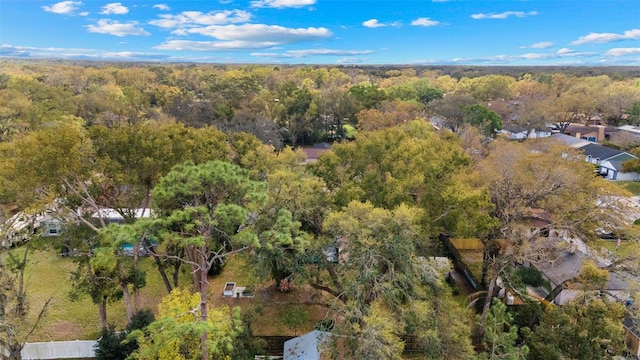 aerial view featuring a wooded view