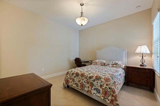 bedroom featuring baseboards