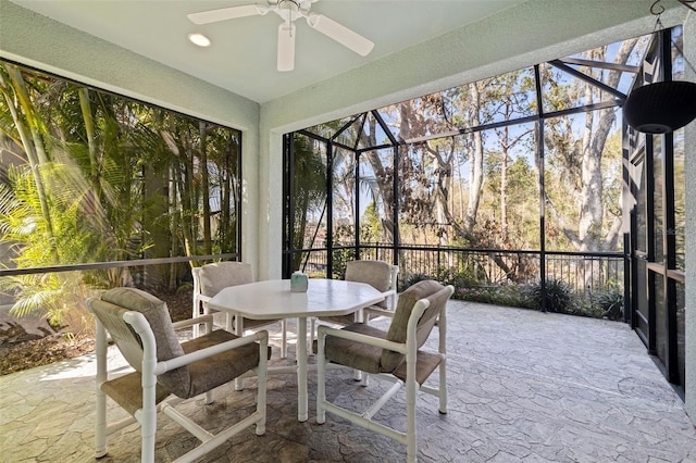 sunroom / solarium featuring ceiling fan