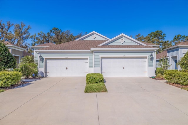 ranch-style home featuring driveway and an attached garage