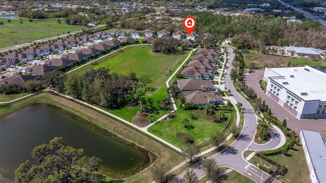 bird's eye view featuring a water view and a residential view