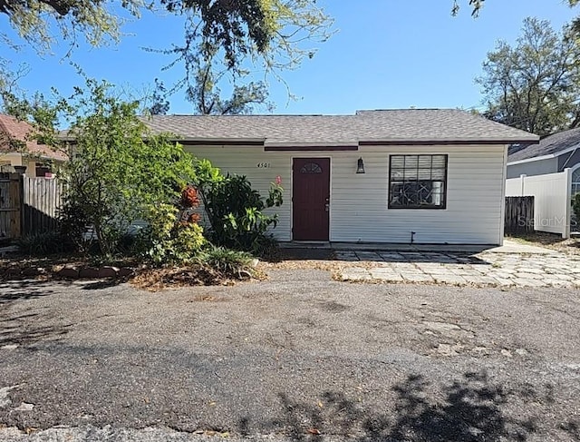 view of front of home featuring fence