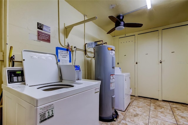 washroom featuring a ceiling fan, electric water heater, washer and clothes dryer, and light tile patterned floors