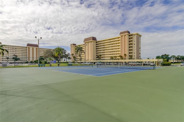 view of tennis court with fence