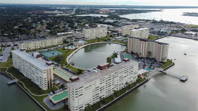 birds eye view of property featuring a water view and a city view