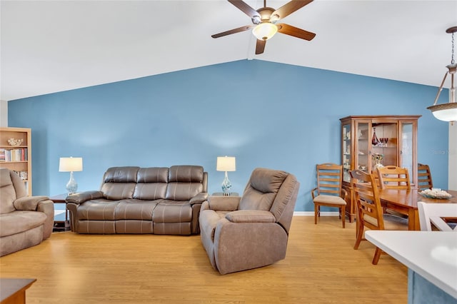 11430 94th St, Largo, FL 33773 - living room featuring baseboards, light wood-type flooring, lofted ceiling, and ceiling fan