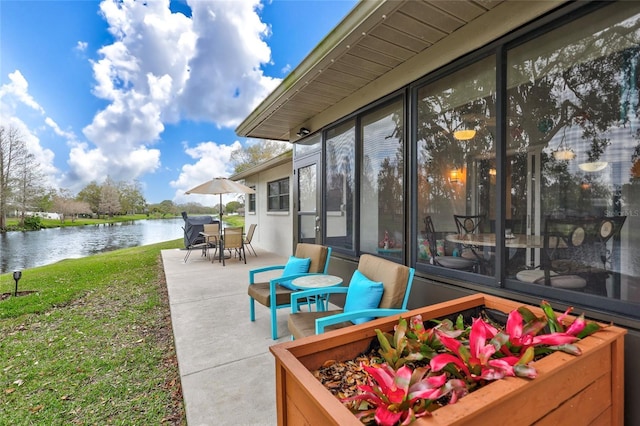 11430 94th St, Largo, FL 33773 - view of patio featuring outdoor dining space and a water view