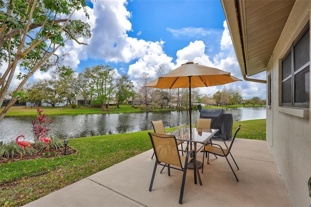 11430 94th St, Largo, FL 33773 - view of patio / terrace with area for grilling, a water view, and outdoor dining space