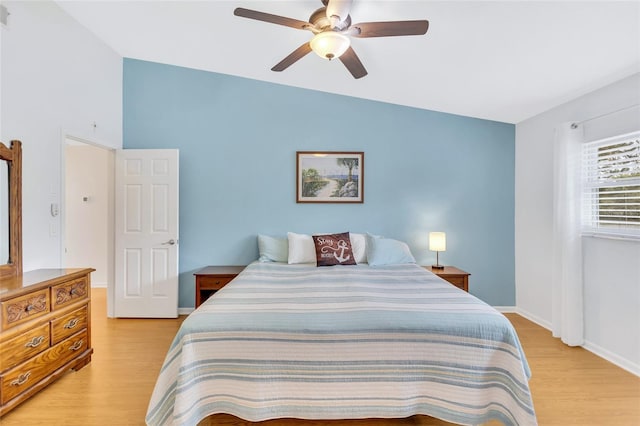 11430 94th St, Largo, FL 33773 - bedroom with baseboards, lofted ceiling, light wood-style flooring, and a ceiling fan