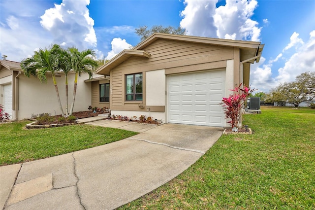 11430 94th St, Largo, FL 33773 - single story home with stucco siding, central air condition unit, an attached garage, driveway, and a front yard